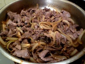 Beef and broth together in pan